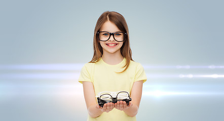 Image showing smiling cute little girl in black eyeglasses