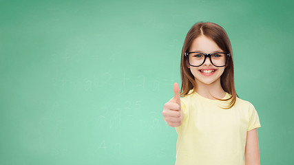 Image showing smiling cute little girl in black eyeglasses