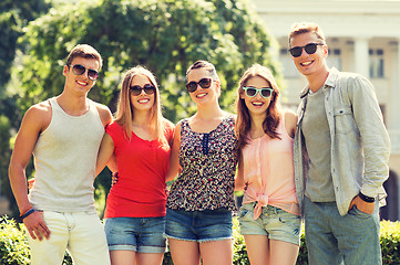 Image showing group of smiling friends outdoors