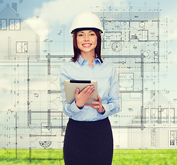 Image showing young smiling businesswoman in white helmet