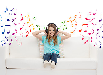 Image showing happy girl in headphones listening to music