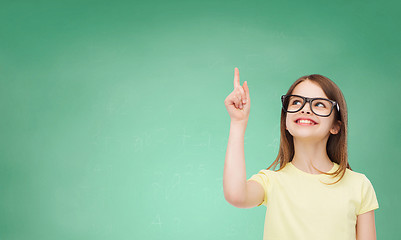 Image showing smiling cute little girl in black eyeglasses