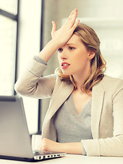 Image showing stressed woman with laptop computer