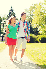 Image showing smiling couple walking in park