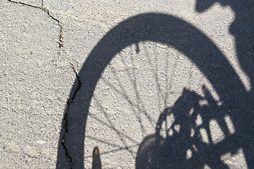 Image showing The shadow of bicycle wheel