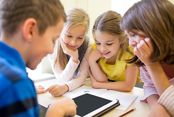 Image showing group of school kids with tablet pc in classroom