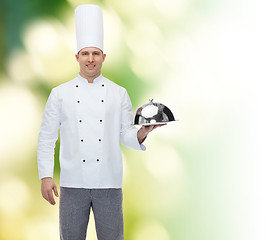 Image showing happy male chef cook holding cloche