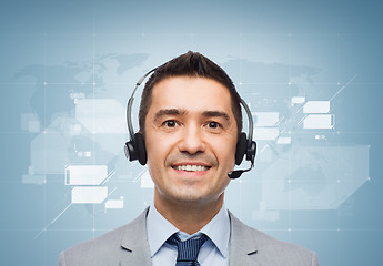 Image showing smiling businessman in headset