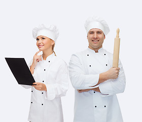 Image showing happy male chef cook holding rolling pin