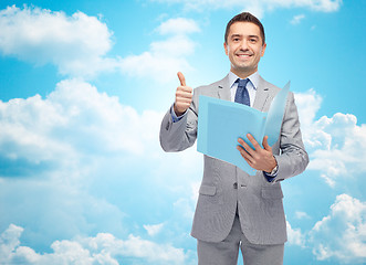 Image showing happy businessman with folder showing thumbs up