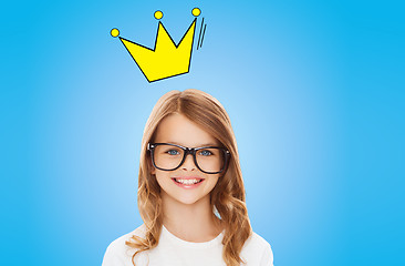 Image showing smiling little girl in glasses with crown