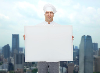 Image showing happy male chef cook holding white blank big board