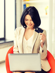 Image showing businesswoman with laptop and credit card