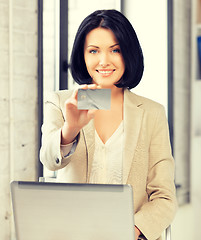 Image showing happy woman with laptop computer and credit card