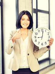 Image showing businesswoman with clock