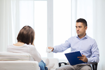 Image showing doctor and young woman meeting at home visit