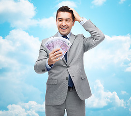 Image showing happy laughing businessman with euro money