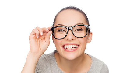 Image showing asian woman adjusting eyeglasses