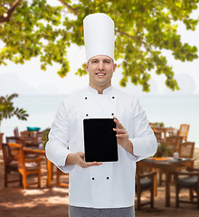 Image showing happy male chef cook showing with tablet pc