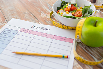 Image showing close up of diet plan and food on table