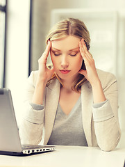 Image showing tired woman with laptop computer