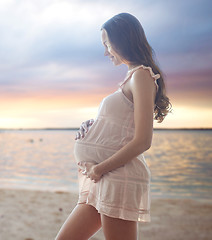 Image showing happy pregnant woman in chemise