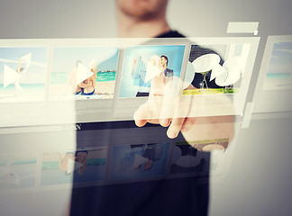 Image showing man pressing button on virtual screen