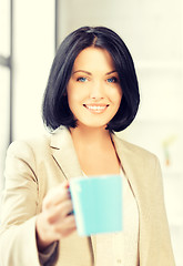 Image showing lovely businesswoman with mug