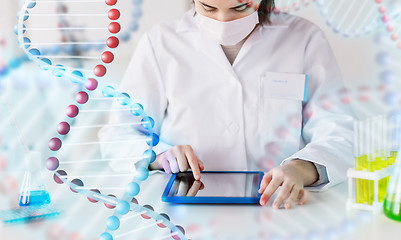 Image showing close up of scientist with tablet pc in laboratory