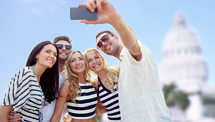 Image showing friends taking selfie with smartphone