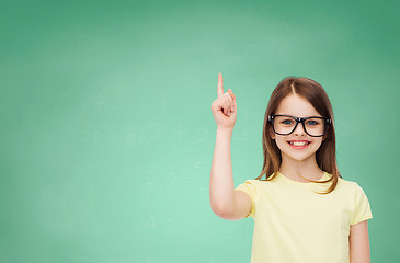 Image showing smiling cute little girl in black eyeglasses