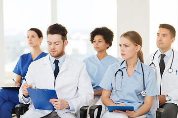 Image showing group of happy doctors on seminar at hospital