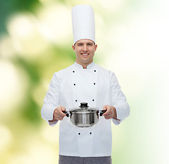 Image showing happy male chef cook holding pot