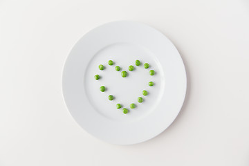 Image showing close up of plate with peas  in heart shape 