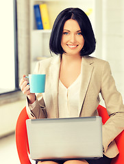 Image showing happy woman with laptop computer