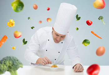 Image showing happy male chef cook decorating dish