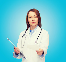 Image showing calm female doctor with clipboard