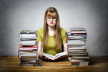 Image showing young woman is reading book