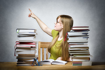 Image showing Female teacher pointing back