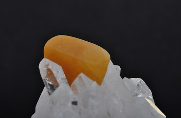 Image showing Orange calcite on rock crystal