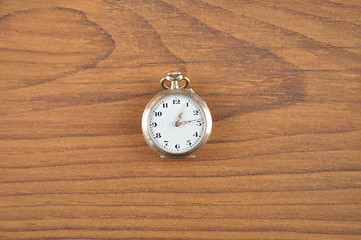 Image showing Pocket watch on wood