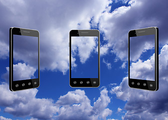 Image showing smart-phones transparent on blue sky background