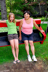 Image showing Family on swings