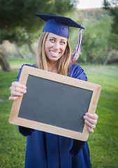 Image showing Woman Holding Diploma and Blank Chalkboard Wearing Cap and Gown
