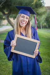 Image showing Woman Holding Diploma and Blank Chalkboard Wearing Cap and Gown