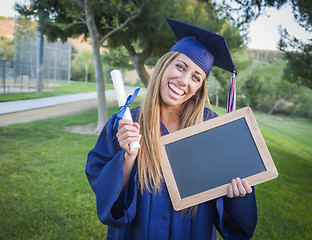 Image showing Woman Holding Diploma and Blank Chalkboard Wearing Cap and Gown