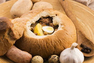 Image showing traditional white borscht (zurek) with sausage,egg and mushrooms