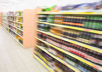 Image showing Shelves with beverages bottles in grocery food store in supermar