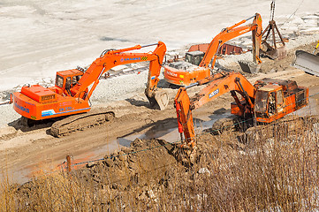 Image showing Excavators on pedestrian quay construction. Tyumen