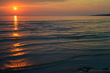 Image showing Bright orange sunset at the sea